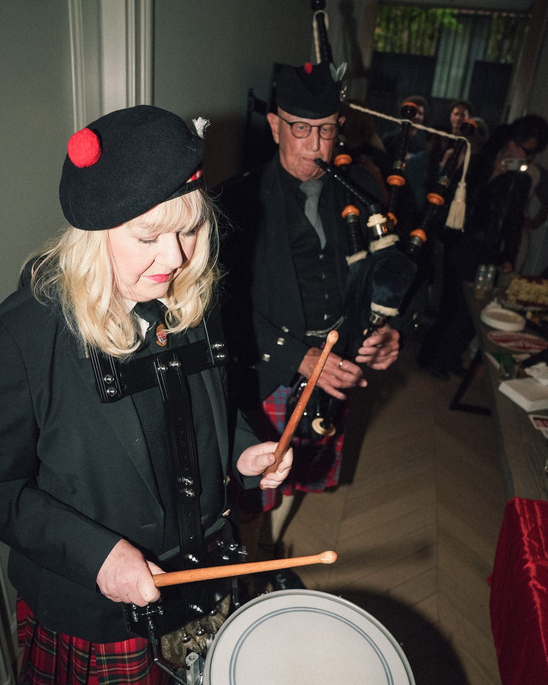 Bagpiper and drummer in kilts performing at the Seraya AW1 party — photo by vinny.mp4, Stockholm